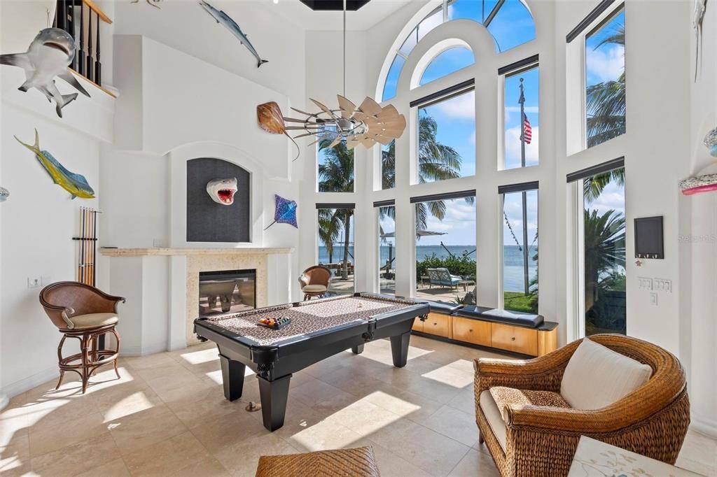Discover the epitome of luxury living at 2 River Falls Drive, Cocoa Beach, Florida. This 5-bedroom, 6-bathroom custom estate, fully remodeled in 2022, offers 150 feet of pristine river frontage and unobstructed views.