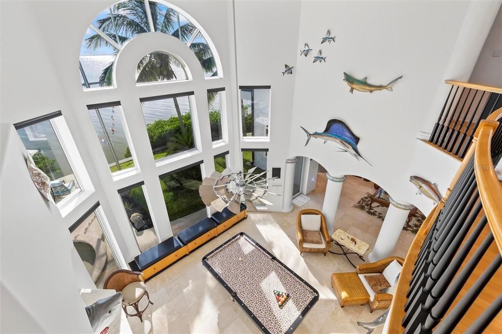 Discover the epitome of luxury living at 2 River Falls Drive, Cocoa Beach, Florida. This 5-bedroom, 6-bathroom custom estate, fully remodeled in 2022, offers 150 feet of pristine river frontage and unobstructed views.