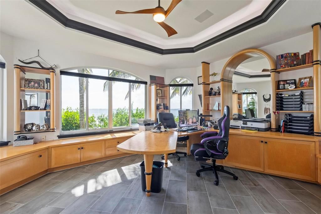 Discover the epitome of luxury living at 2 River Falls Drive, Cocoa Beach, Florida. This 5-bedroom, 6-bathroom custom estate, fully remodeled in 2022, offers 150 feet of pristine river frontage and unobstructed views.