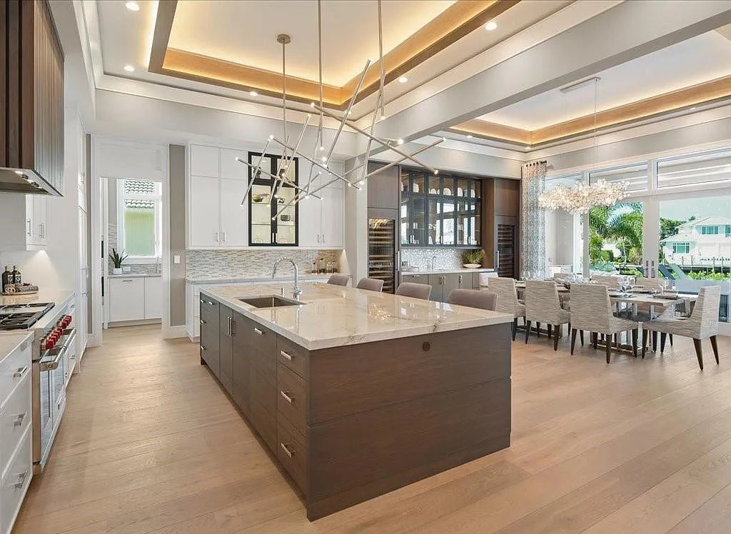 Experience waterfront luxury like never before at 3841 Crayton Road in Naples, Florida. This 5-bedroom, 6-bathroom masterpiece, built in 2023, is the result of a remarkable collaboration between Knauf Koenig, Falconer Jones, and Clive Daniel interior designers.