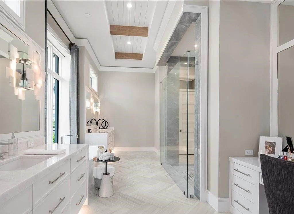 Experience waterfront luxury like never before at 3841 Crayton Road in Naples, Florida. This 5-bedroom, 6-bathroom masterpiece, built in 2023, is the result of a remarkable collaboration between Knauf Koenig, Falconer Jones, and Clive Daniel interior designers.