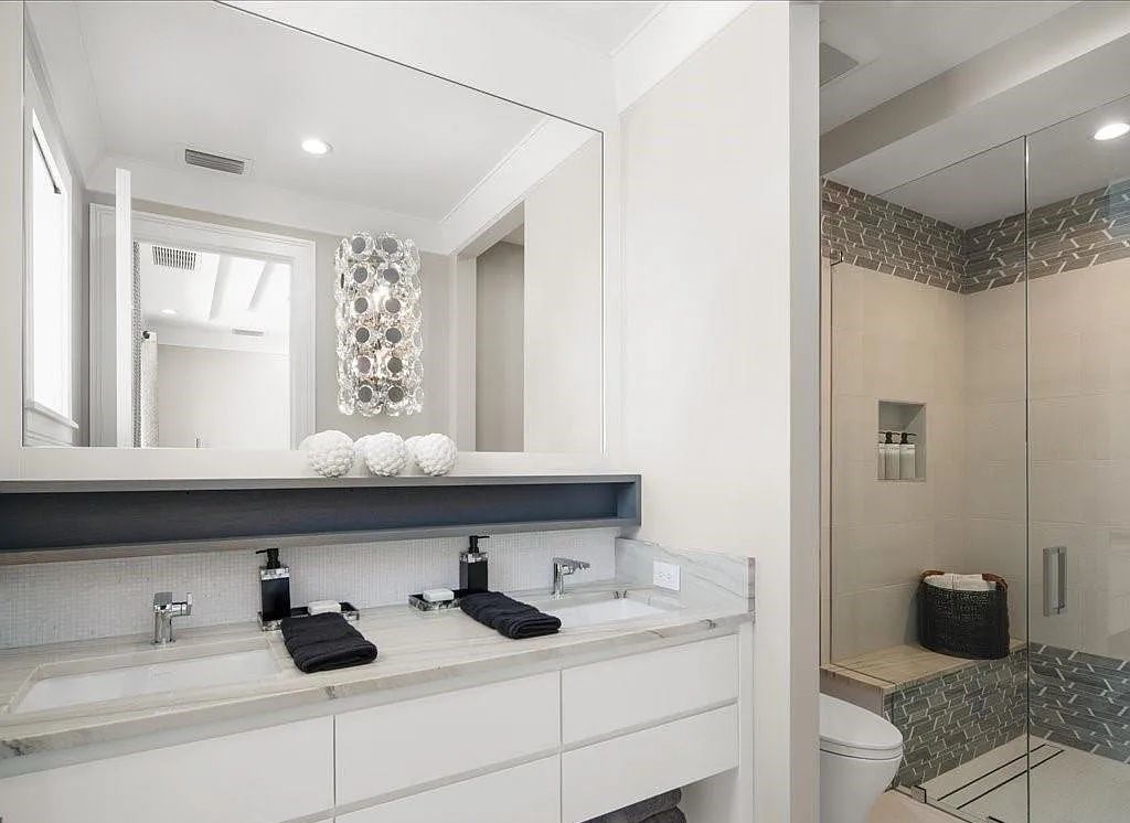 Experience waterfront luxury like never before at 3841 Crayton Road in Naples, Florida. This 5-bedroom, 6-bathroom masterpiece, built in 2023, is the result of a remarkable collaboration between Knauf Koenig, Falconer Jones, and Clive Daniel interior designers.