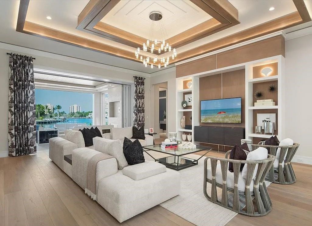 Experience waterfront luxury like never before at 3841 Crayton Road in Naples, Florida. This 5-bedroom, 6-bathroom masterpiece, built in 2023, is the result of a remarkable collaboration between Knauf Koenig, Falconer Jones, and Clive Daniel interior designers.