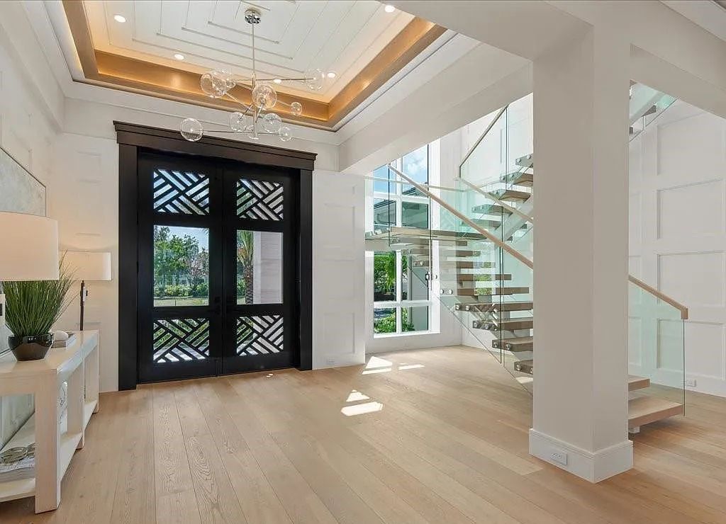 Experience waterfront luxury like never before at 3841 Crayton Road in Naples, Florida. This 5-bedroom, 6-bathroom masterpiece, built in 2023, is the result of a remarkable collaboration between Knauf Koenig, Falconer Jones, and Clive Daniel interior designers.