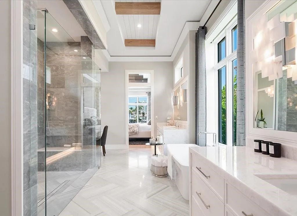 Experience waterfront luxury like never before at 3841 Crayton Road in Naples, Florida. This 5-bedroom, 6-bathroom masterpiece, built in 2023, is the result of a remarkable collaboration between Knauf Koenig, Falconer Jones, and Clive Daniel interior designers.