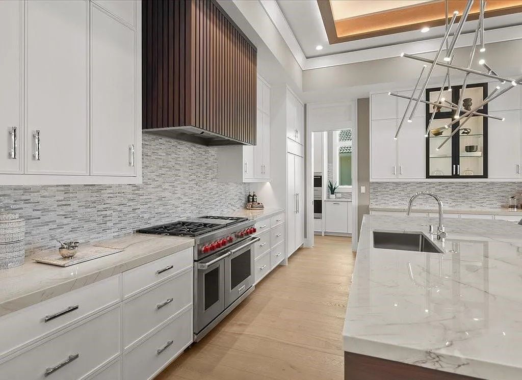 Experience waterfront luxury like never before at 3841 Crayton Road in Naples, Florida. This 5-bedroom, 6-bathroom masterpiece, built in 2023, is the result of a remarkable collaboration between Knauf Koenig, Falconer Jones, and Clive Daniel interior designers.