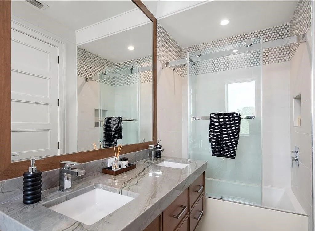Experience waterfront luxury like never before at 3841 Crayton Road in Naples, Florida. This 5-bedroom, 6-bathroom masterpiece, built in 2023, is the result of a remarkable collaboration between Knauf Koenig, Falconer Jones, and Clive Daniel interior designers.