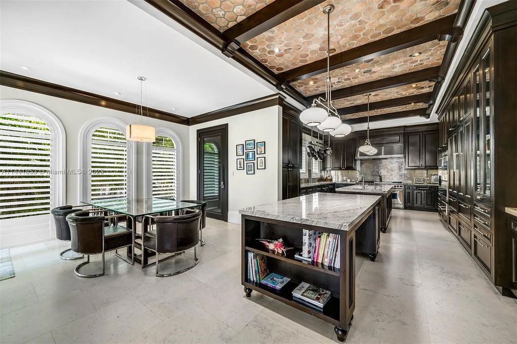 Discover the epitome of luxury waterfront living at 3590 Crystal View Court, Miami, Florida. This magnificent mansion offers 6 bedrooms, 10 bathrooms, and 13,930 square feet of living space on a spacious 0.45-acre lot.
