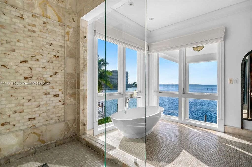 Discover the epitome of luxury waterfront living at 3590 Crystal View Court, Miami, Florida. This magnificent mansion offers 6 bedrooms, 10 bathrooms, and 13,930 square feet of living space on a spacious 0.45-acre lot.