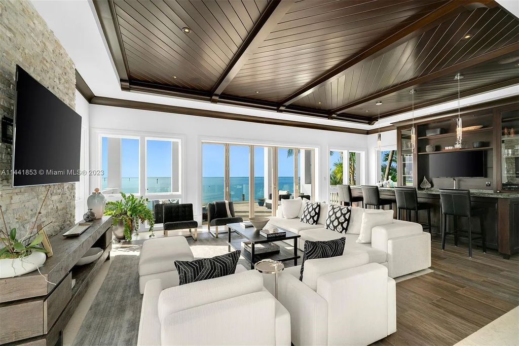 Discover the epitome of luxury waterfront living at 3590 Crystal View Court, Miami, Florida. This magnificent mansion offers 6 bedrooms, 10 bathrooms, and 13,930 square feet of living space on a spacious 0.45-acre lot.