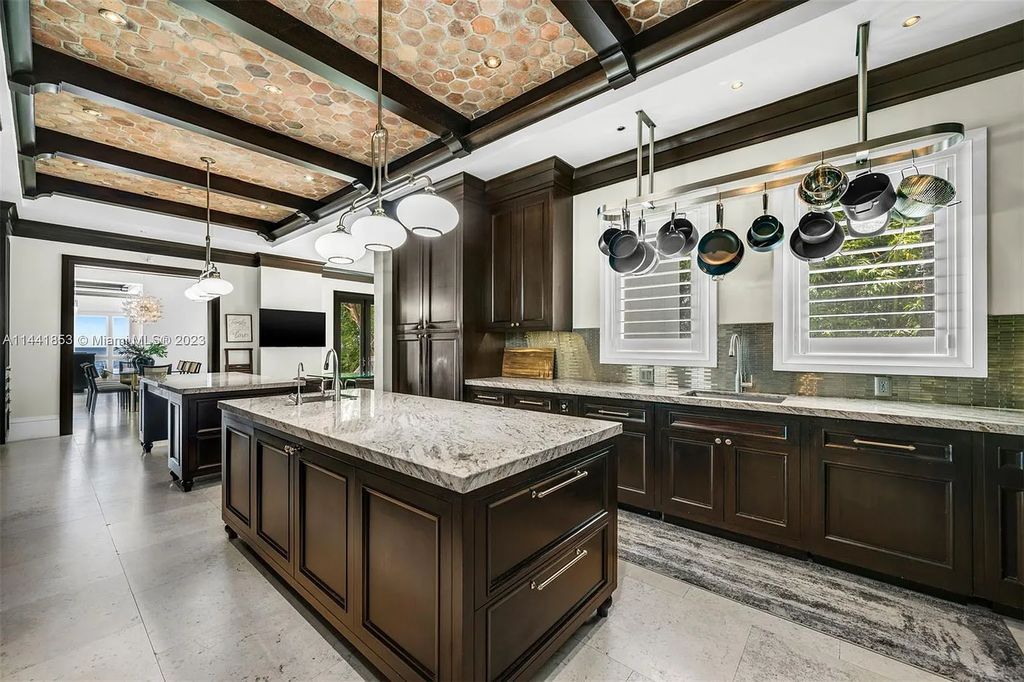 Discover the epitome of luxury waterfront living at 3590 Crystal View Court, Miami, Florida. This magnificent mansion offers 6 bedrooms, 10 bathrooms, and 13,930 square feet of living space on a spacious 0.45-acre lot.