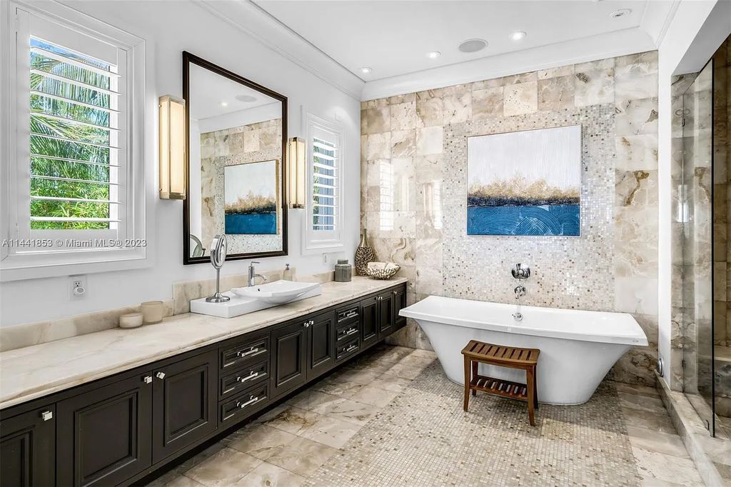 Discover the epitome of luxury waterfront living at 3590 Crystal View Court, Miami, Florida. This magnificent mansion offers 6 bedrooms, 10 bathrooms, and 13,930 square feet of living space on a spacious 0.45-acre lot.