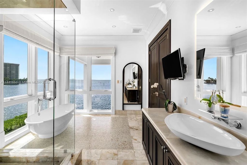 Discover the epitome of luxury waterfront living at 3590 Crystal View Court, Miami, Florida. This magnificent mansion offers 6 bedrooms, 10 bathrooms, and 13,930 square feet of living space on a spacious 0.45-acre lot.
