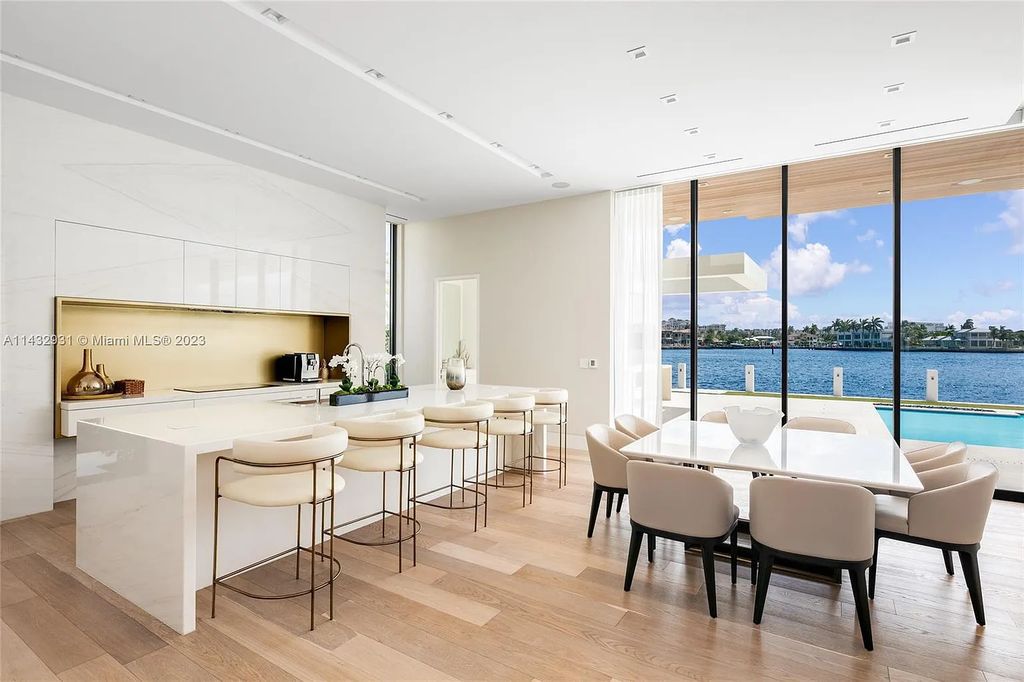 Luxury awaits in this 2021-built, 6-bed, 9-bath modern masterpiece in Fort Lauderdale's Harbor Beach gated community. Designed by Randall Stofft and crafted by Sarkela Corp, this 9,451 sq ft home features 120 ft of Intracoastal frontage, a lap pool, and outdoor kitchen.
