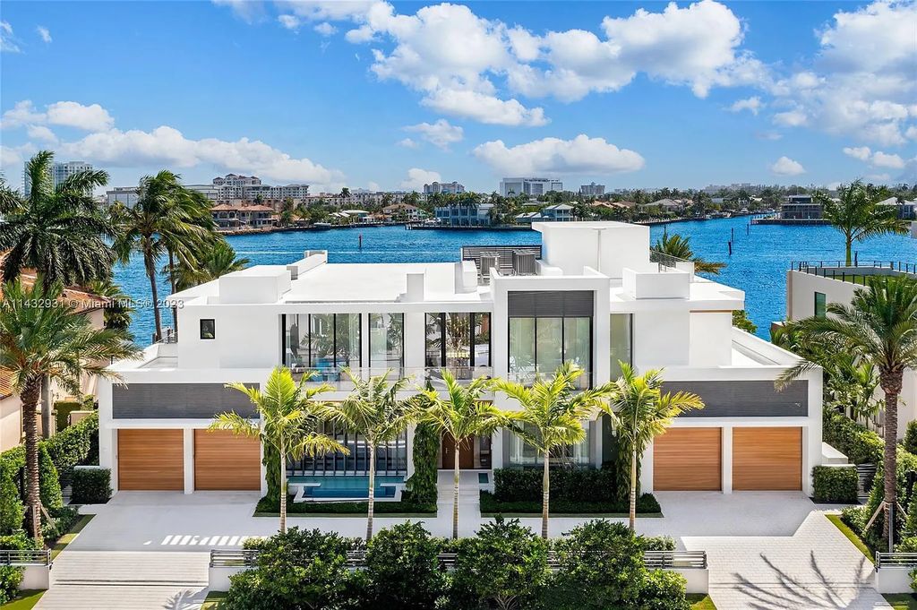 Luxury awaits in this 2021-built, 6-bed, 9-bath modern masterpiece in Fort Lauderdale's Harbor Beach gated community. Designed by Randall Stofft and crafted by Sarkela Corp, this 9,451 sq ft home features 120 ft of Intracoastal frontage, a lap pool, and outdoor kitchen.