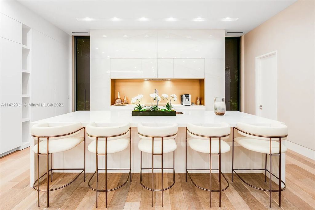 Luxury awaits in this 2021-built, 6-bed, 9-bath modern masterpiece in Fort Lauderdale's Harbor Beach gated community. Designed by Randall Stofft and crafted by Sarkela Corp, this 9,451 sq ft home features 120 ft of Intracoastal frontage, a lap pool, and outdoor kitchen.