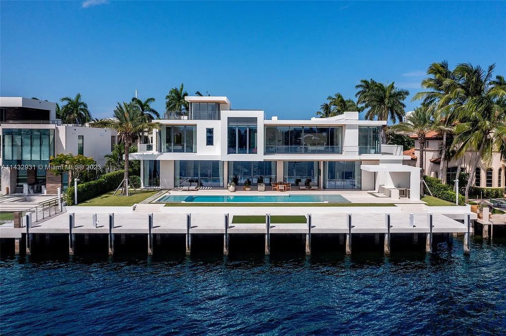 Luxury awaits in this 2021-built, 6-bed, 9-bath modern masterpiece in Fort Lauderdale's Harbor Beach gated community. Designed by Randall Stofft and crafted by Sarkela Corp, this 9,451 sq ft home features 120 ft of Intracoastal frontage, a lap pool, and outdoor kitchen.