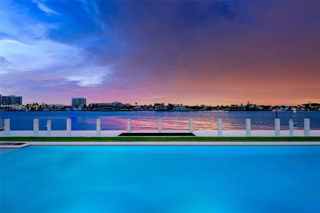 Luxury awaits in this 2021-built, 6-bed, 9-bath modern masterpiece in Fort Lauderdale's Harbor Beach gated community. Designed by Randall Stofft and crafted by Sarkela Corp, this 9,451 sq ft home features 120 ft of Intracoastal frontage, a lap pool, and outdoor kitchen.