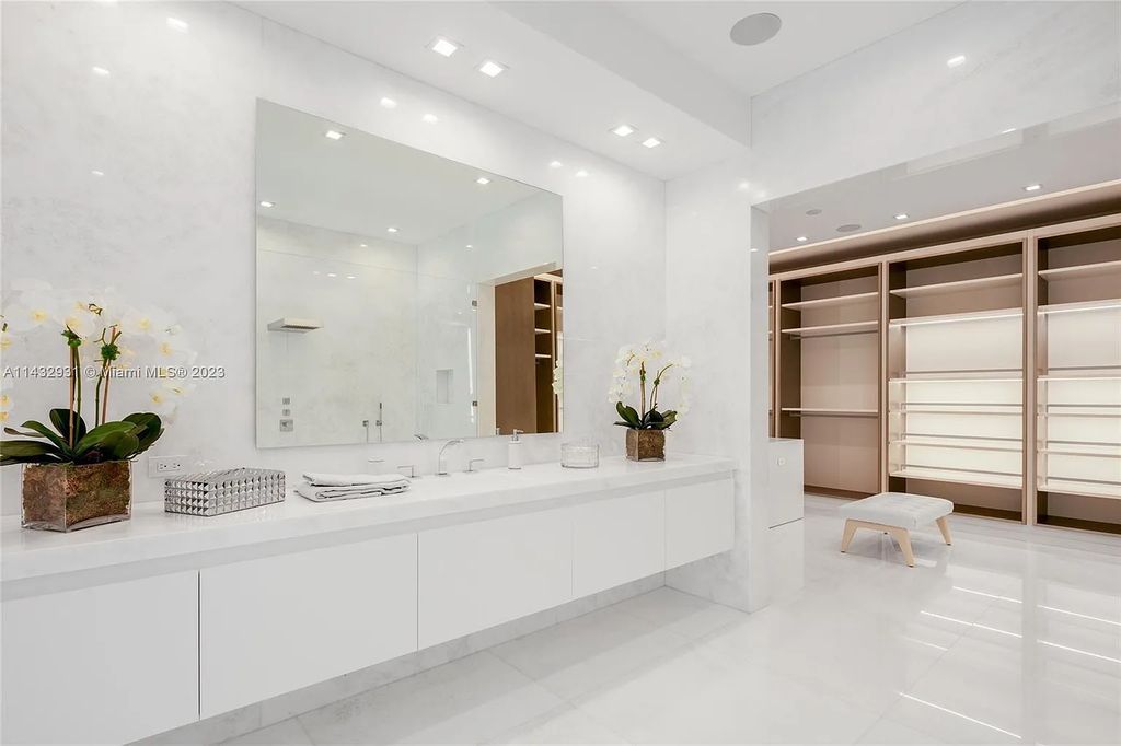 Luxury awaits in this 2021-built, 6-bed, 9-bath modern masterpiece in Fort Lauderdale's Harbor Beach gated community. Designed by Randall Stofft and crafted by Sarkela Corp, this 9,451 sq ft home features 120 ft of Intracoastal frontage, a lap pool, and outdoor kitchen.