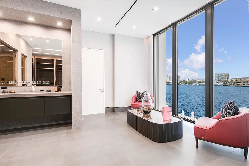 Luxury awaits in this 2021-built, 6-bed, 9-bath modern masterpiece in Fort Lauderdale's Harbor Beach gated community. Designed by Randall Stofft and crafted by Sarkela Corp, this 9,451 sq ft home features 120 ft of Intracoastal frontage, a lap pool, and outdoor kitchen.