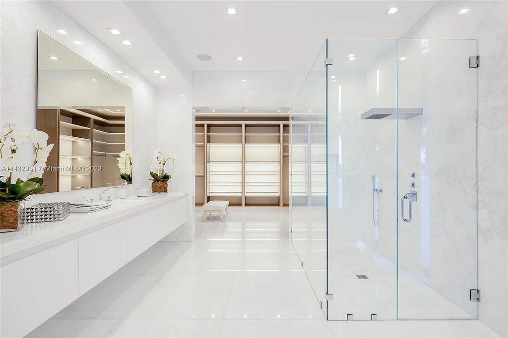 Luxury awaits in this 2021-built, 6-bed, 9-bath modern masterpiece in Fort Lauderdale's Harbor Beach gated community. Designed by Randall Stofft and crafted by Sarkela Corp, this 9,451 sq ft home features 120 ft of Intracoastal frontage, a lap pool, and outdoor kitchen.
