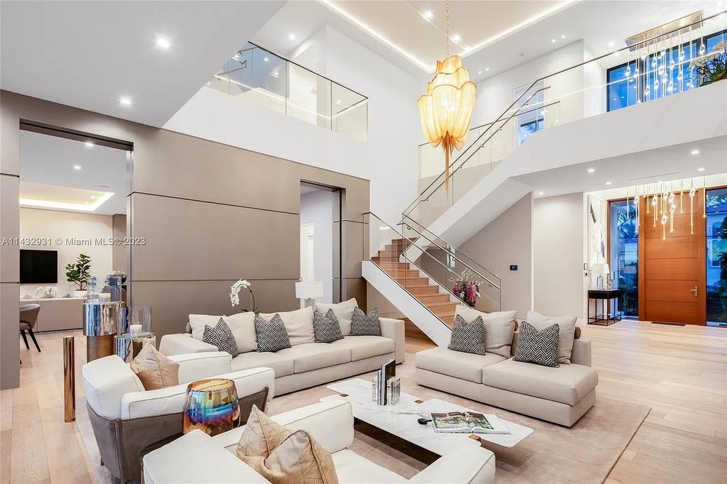 Luxury awaits in this 2021-built, 6-bed, 9-bath modern masterpiece in Fort Lauderdale's Harbor Beach gated community. Designed by Randall Stofft and crafted by Sarkela Corp, this 9,451 sq ft home features 120 ft of Intracoastal frontage, a lap pool, and outdoor kitchen.