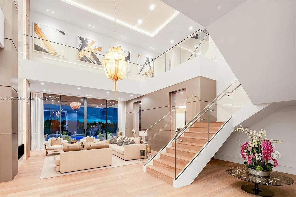 Luxury awaits in this 2021-built, 6-bed, 9-bath modern masterpiece in Fort Lauderdale's Harbor Beach gated community. Designed by Randall Stofft and crafted by Sarkela Corp, this 9,451 sq ft home features 120 ft of Intracoastal frontage, a lap pool, and outdoor kitchen.