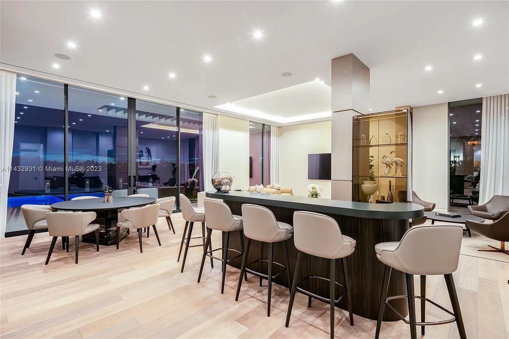 Luxury awaits in this 2021-built, 6-bed, 9-bath modern masterpiece in Fort Lauderdale's Harbor Beach gated community. Designed by Randall Stofft and crafted by Sarkela Corp, this 9,451 sq ft home features 120 ft of Intracoastal frontage, a lap pool, and outdoor kitchen.