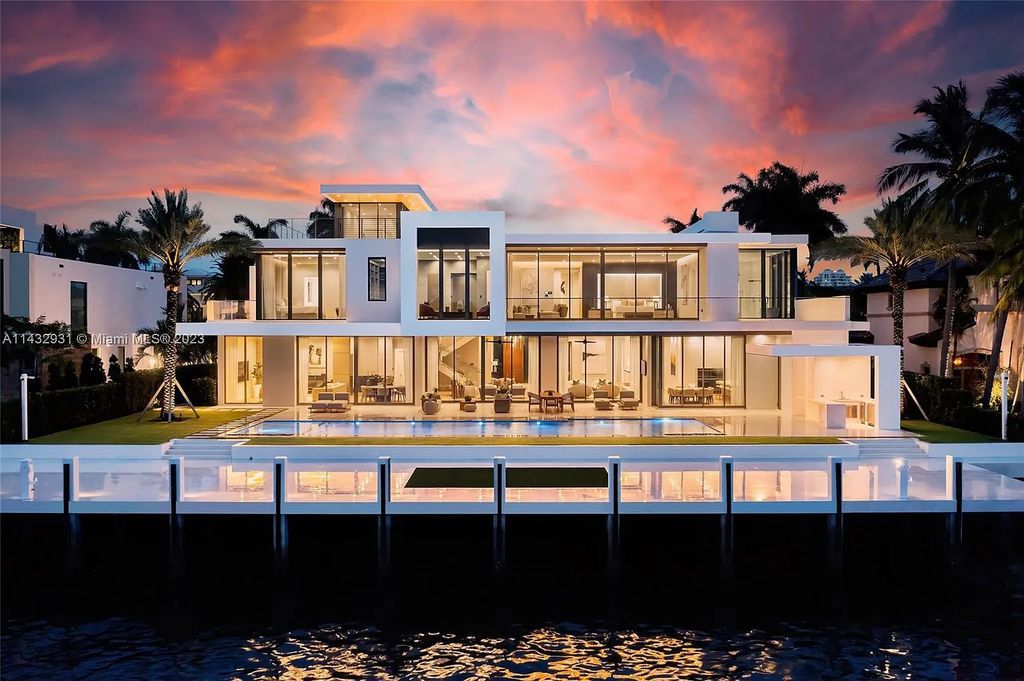 Luxury awaits in this 2021-built, 6-bed, 9-bath modern masterpiece in Fort Lauderdale's Harbor Beach gated community. Designed by Randall Stofft and crafted by Sarkela Corp, this 9,451 sq ft home features 120 ft of Intracoastal frontage, a lap pool, and outdoor kitchen.