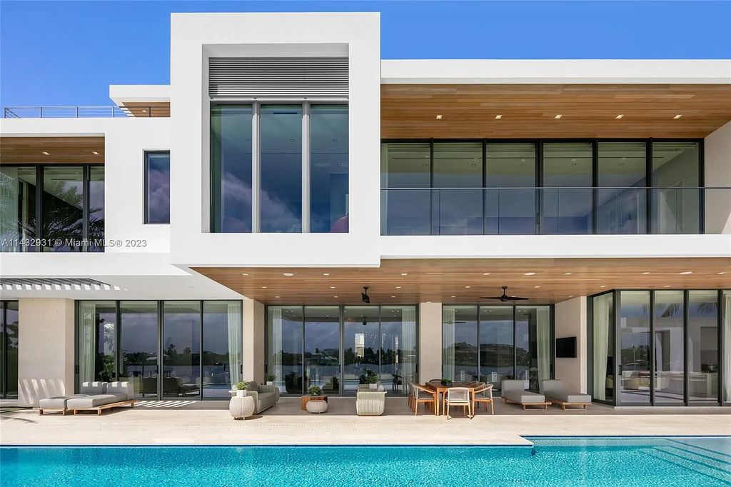 Luxury awaits in this 2021-built, 6-bed, 9-bath modern masterpiece in Fort Lauderdale's Harbor Beach gated community. Designed by Randall Stofft and crafted by Sarkela Corp, this 9,451 sq ft home features 120 ft of Intracoastal frontage, a lap pool, and outdoor kitchen.