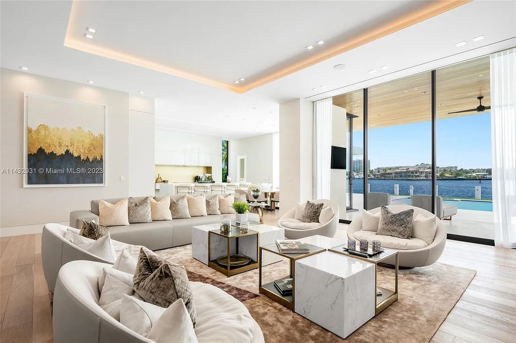 Luxury awaits in this 2021-built, 6-bed, 9-bath modern masterpiece in Fort Lauderdale's Harbor Beach gated community. Designed by Randall Stofft and crafted by Sarkela Corp, this 9,451 sq ft home features 120 ft of Intracoastal frontage, a lap pool, and outdoor kitchen.