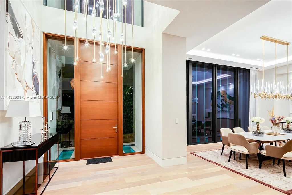 Luxury awaits in this 2021-built, 6-bed, 9-bath modern masterpiece in Fort Lauderdale's Harbor Beach gated community. Designed by Randall Stofft and crafted by Sarkela Corp, this 9,451 sq ft home features 120 ft of Intracoastal frontage, a lap pool, and outdoor kitchen.