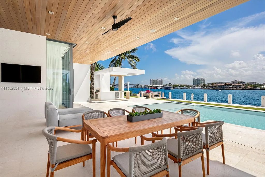 Luxury awaits in this 2021-built, 6-bed, 9-bath modern masterpiece in Fort Lauderdale's Harbor Beach gated community. Designed by Randall Stofft and crafted by Sarkela Corp, this 9,451 sq ft home features 120 ft of Intracoastal frontage, a lap pool, and outdoor kitchen.