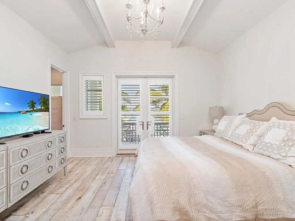 Discover your dream home at 1340 Caxambas Ct, Marco Island, Florida! This 5-bed, 5-bath luxury residence with a theater room boasts 5,007 sq ft of impeccable craftsmanship, situated on 0.59 acres with 248 ft of water frontage and a newer seawall, ensuring endless views and quick access to Caxambas Pass.