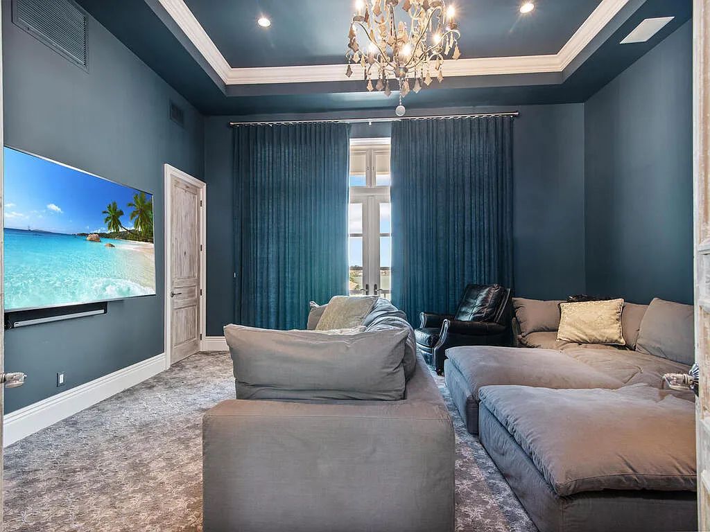Discover your dream home at 1340 Caxambas Ct, Marco Island, Florida! This 5-bed, 5-bath luxury residence with a theater room boasts 5,007 sq ft of impeccable craftsmanship, situated on 0.59 acres with 248 ft of water frontage and a newer seawall, ensuring endless views and quick access to Caxambas Pass.