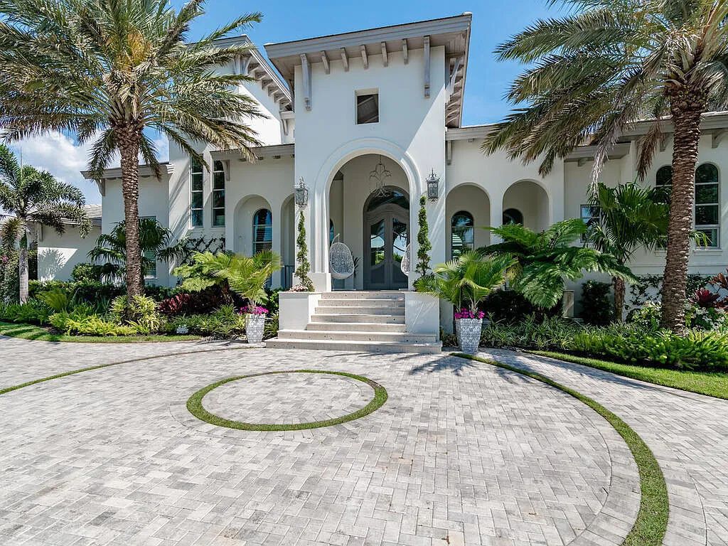 Discover your dream home at 1340 Caxambas Ct, Marco Island, Florida! This 5-bed, 5-bath luxury residence with a theater room boasts 5,007 sq ft of impeccable craftsmanship, situated on 0.59 acres with 248 ft of water frontage and a newer seawall, ensuring endless views and quick access to Caxambas Pass.