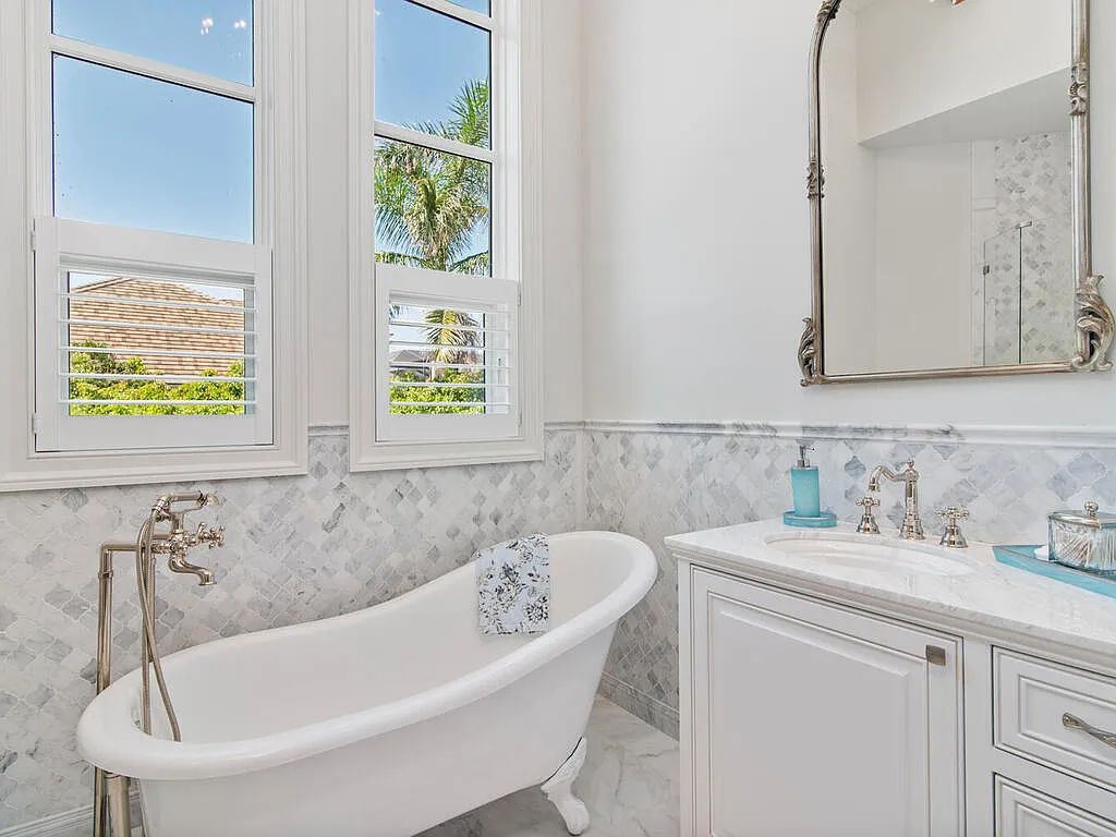 Discover your dream home at 1340 Caxambas Ct, Marco Island, Florida! This 5-bed, 5-bath luxury residence with a theater room boasts 5,007 sq ft of impeccable craftsmanship, situated on 0.59 acres with 248 ft of water frontage and a newer seawall, ensuring endless views and quick access to Caxambas Pass.