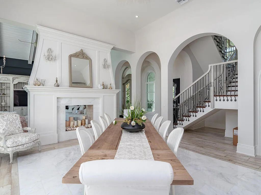 Discover your dream home at 1340 Caxambas Ct, Marco Island, Florida! This 5-bed, 5-bath luxury residence with a theater room boasts 5,007 sq ft of impeccable craftsmanship, situated on 0.59 acres with 248 ft of water frontage and a newer seawall, ensuring endless views and quick access to Caxambas Pass.