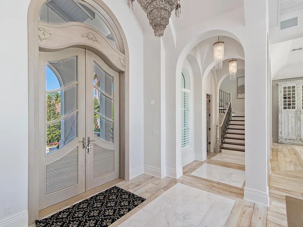 Discover your dream home at 1340 Caxambas Ct, Marco Island, Florida! This 5-bed, 5-bath luxury residence with a theater room boasts 5,007 sq ft of impeccable craftsmanship, situated on 0.59 acres with 248 ft of water frontage and a newer seawall, ensuring endless views and quick access to Caxambas Pass.