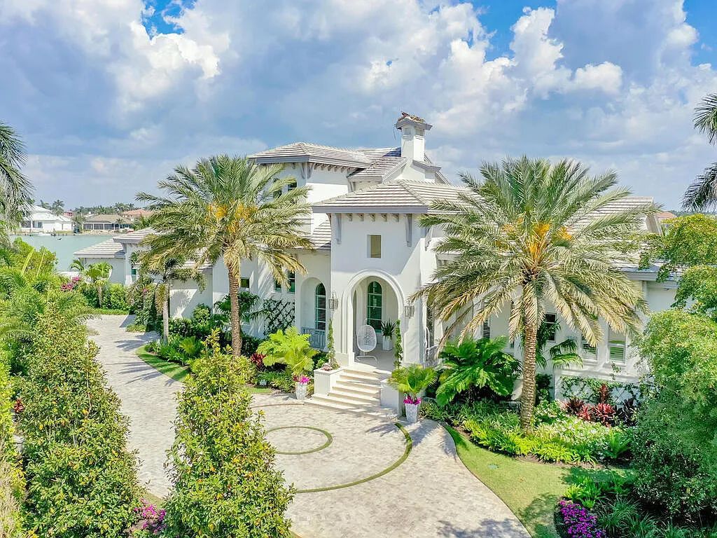 Discover your dream home at 1340 Caxambas Ct, Marco Island, Florida! This 5-bed, 5-bath luxury residence with a theater room boasts 5,007 sq ft of impeccable craftsmanship, situated on 0.59 acres with 248 ft of water frontage and a newer seawall, ensuring endless views and quick access to Caxambas Pass.