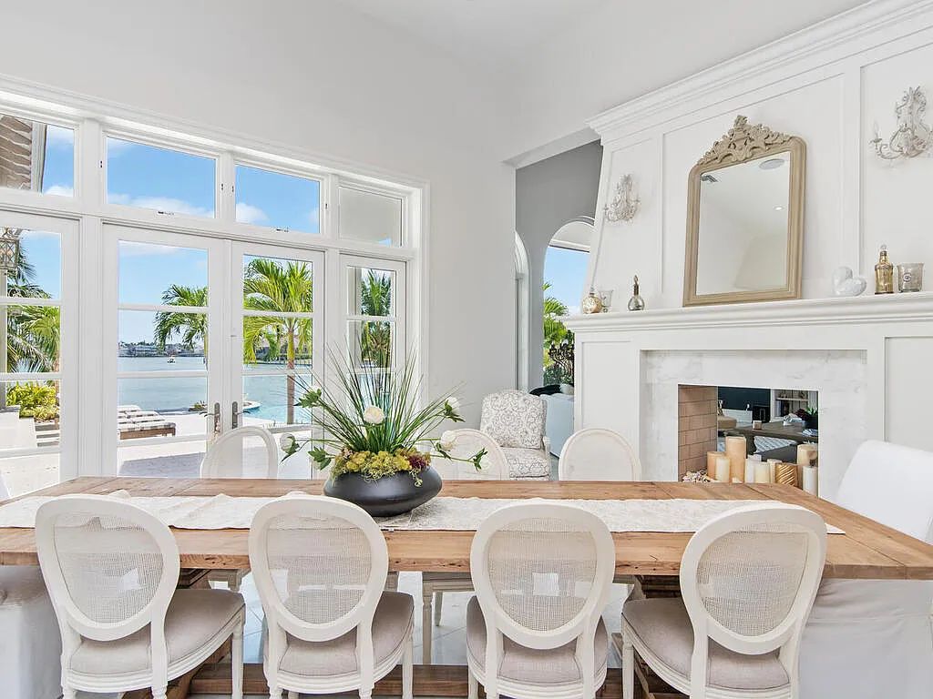 Discover your dream home at 1340 Caxambas Ct, Marco Island, Florida! This 5-bed, 5-bath luxury residence with a theater room boasts 5,007 sq ft of impeccable craftsmanship, situated on 0.59 acres with 248 ft of water frontage and a newer seawall, ensuring endless views and quick access to Caxambas Pass.