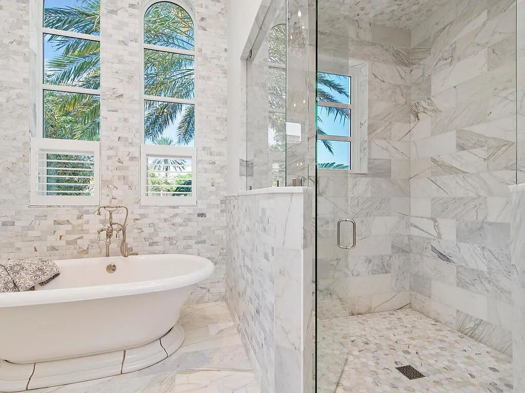 Discover your dream home at 1340 Caxambas Ct, Marco Island, Florida! This 5-bed, 5-bath luxury residence with a theater room boasts 5,007 sq ft of impeccable craftsmanship, situated on 0.59 acres with 248 ft of water frontage and a newer seawall, ensuring endless views and quick access to Caxambas Pass.