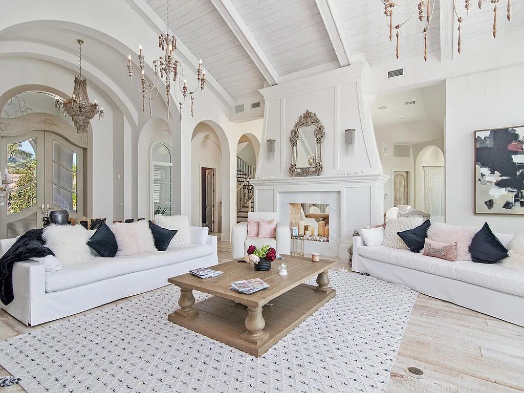 Discover your dream home at 1340 Caxambas Ct, Marco Island, Florida! This 5-bed, 5-bath luxury residence with a theater room boasts 5,007 sq ft of impeccable craftsmanship, situated on 0.59 acres with 248 ft of water frontage and a newer seawall, ensuring endless views and quick access to Caxambas Pass.