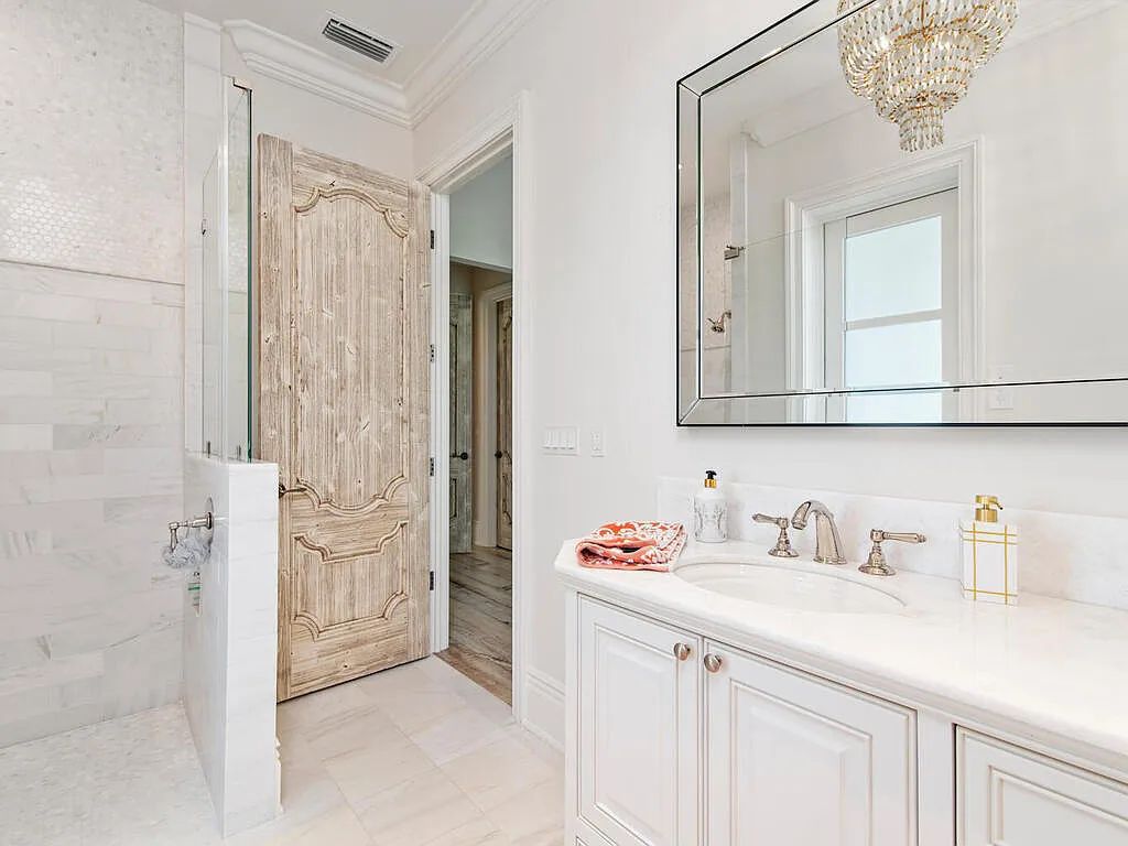 Discover your dream home at 1340 Caxambas Ct, Marco Island, Florida! This 5-bed, 5-bath luxury residence with a theater room boasts 5,007 sq ft of impeccable craftsmanship, situated on 0.59 acres with 248 ft of water frontage and a newer seawall, ensuring endless views and quick access to Caxambas Pass.