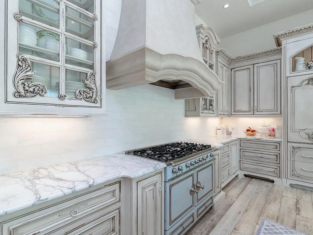 Discover your dream home at 1340 Caxambas Ct, Marco Island, Florida! This 5-bed, 5-bath luxury residence with a theater room boasts 5,007 sq ft of impeccable craftsmanship, situated on 0.59 acres with 248 ft of water frontage and a newer seawall, ensuring endless views and quick access to Caxambas Pass.