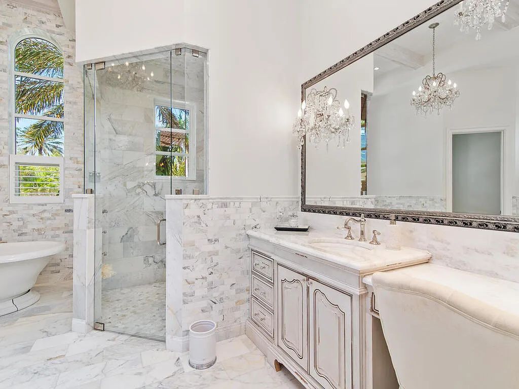 Discover your dream home at 1340 Caxambas Ct, Marco Island, Florida! This 5-bed, 5-bath luxury residence with a theater room boasts 5,007 sq ft of impeccable craftsmanship, situated on 0.59 acres with 248 ft of water frontage and a newer seawall, ensuring endless views and quick access to Caxambas Pass.