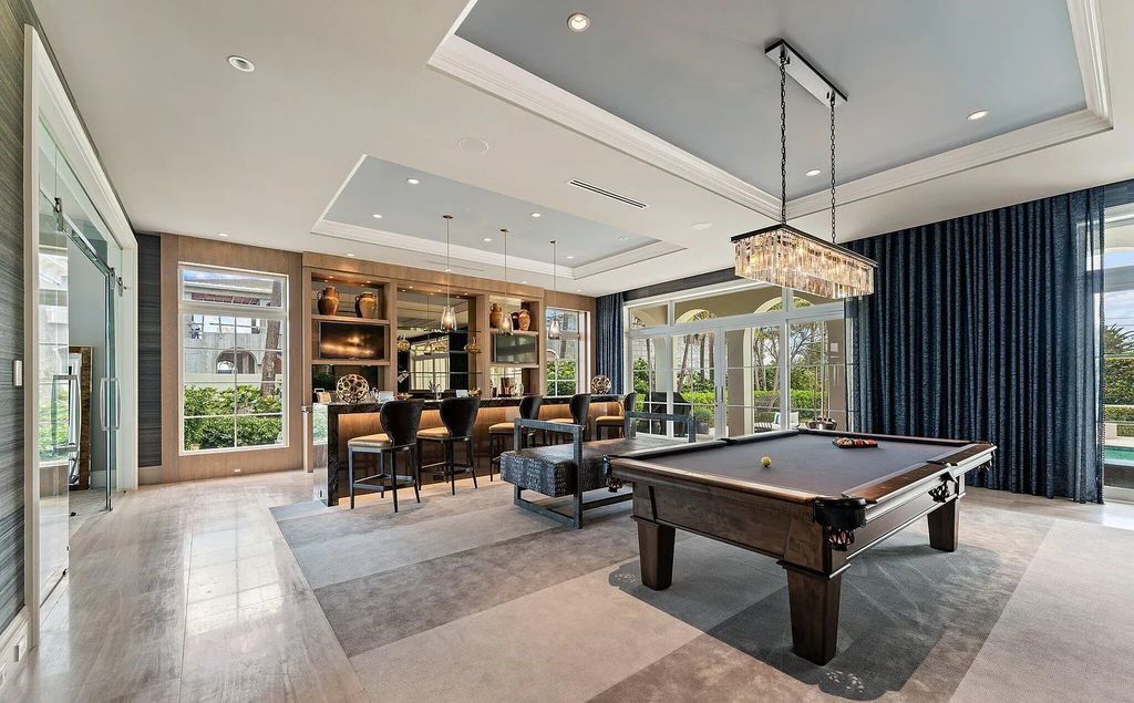 Nestled between the majestic Atlantic Ocean and the tranquil Intracoastal Waterway lies the extraordinary ''Villa Oceano Azul.'' This stunning estate is located in the prestigious estate section of Manalapan, Florida, and embodies the epitome of luxury living.