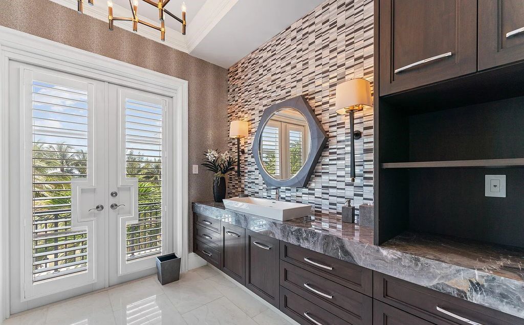 Nestled between the majestic Atlantic Ocean and the tranquil Intracoastal Waterway lies the extraordinary ''Villa Oceano Azul.'' This stunning estate is located in the prestigious estate section of Manalapan, Florida, and embodies the epitome of luxury living.