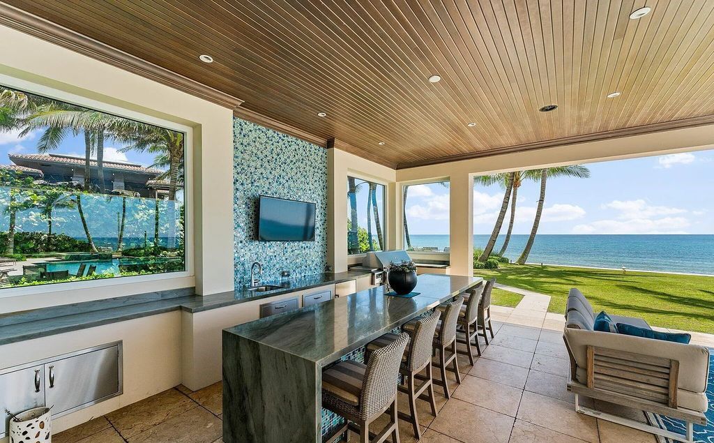 Nestled between the majestic Atlantic Ocean and the tranquil Intracoastal Waterway lies the extraordinary ''Villa Oceano Azul.'' This stunning estate is located in the prestigious estate section of Manalapan, Florida, and embodies the epitome of luxury living.