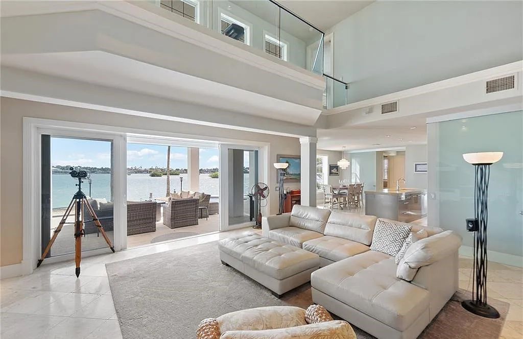 Nestled in Marco Island's prestigious Estate section, 581 Conover Ct is a waterfront gem offering 247' of direct access frontage on Roberts Bay with 11' elevation. This 2000-built Slocum & Christian home boasts an open - living concept, three bedrooms, three baths, and breathtaking water views from every room.